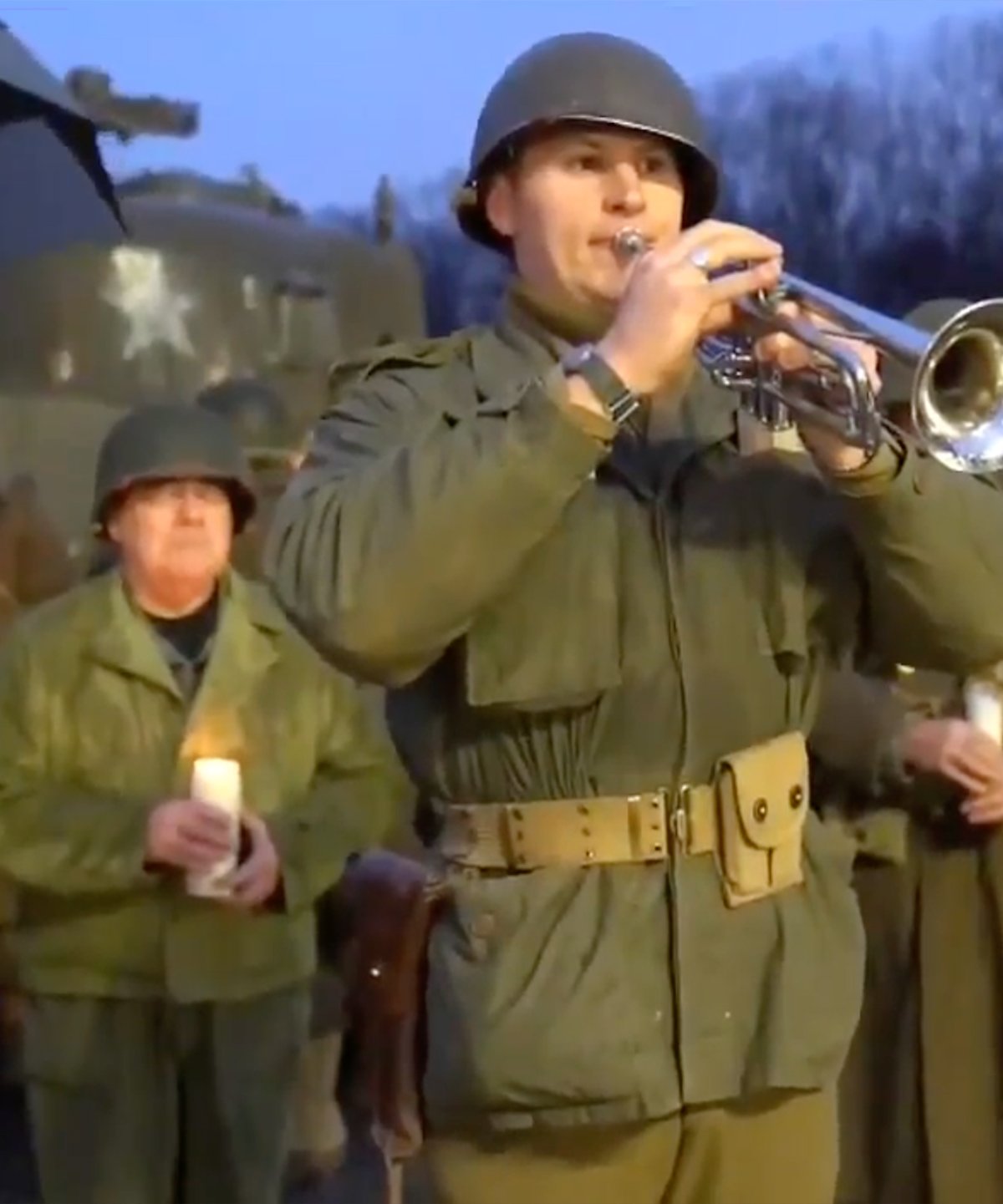 Reenactment soldier playing trumpet in Battle of the Bulge tribute