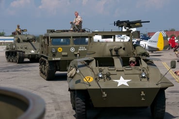 Tanks and Truck driving on flightline of Airshow