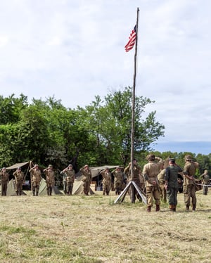 colors - acting soldiers saluting American Flag