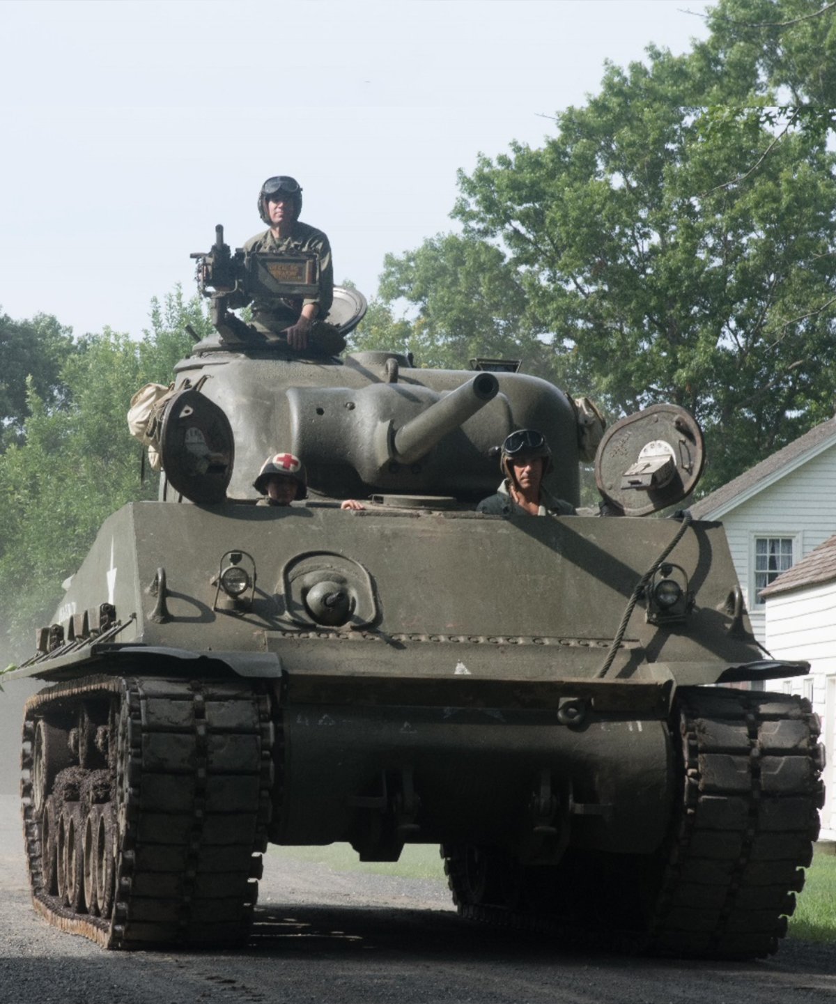 Tank Operator in M4 Sherman going down a gravel road